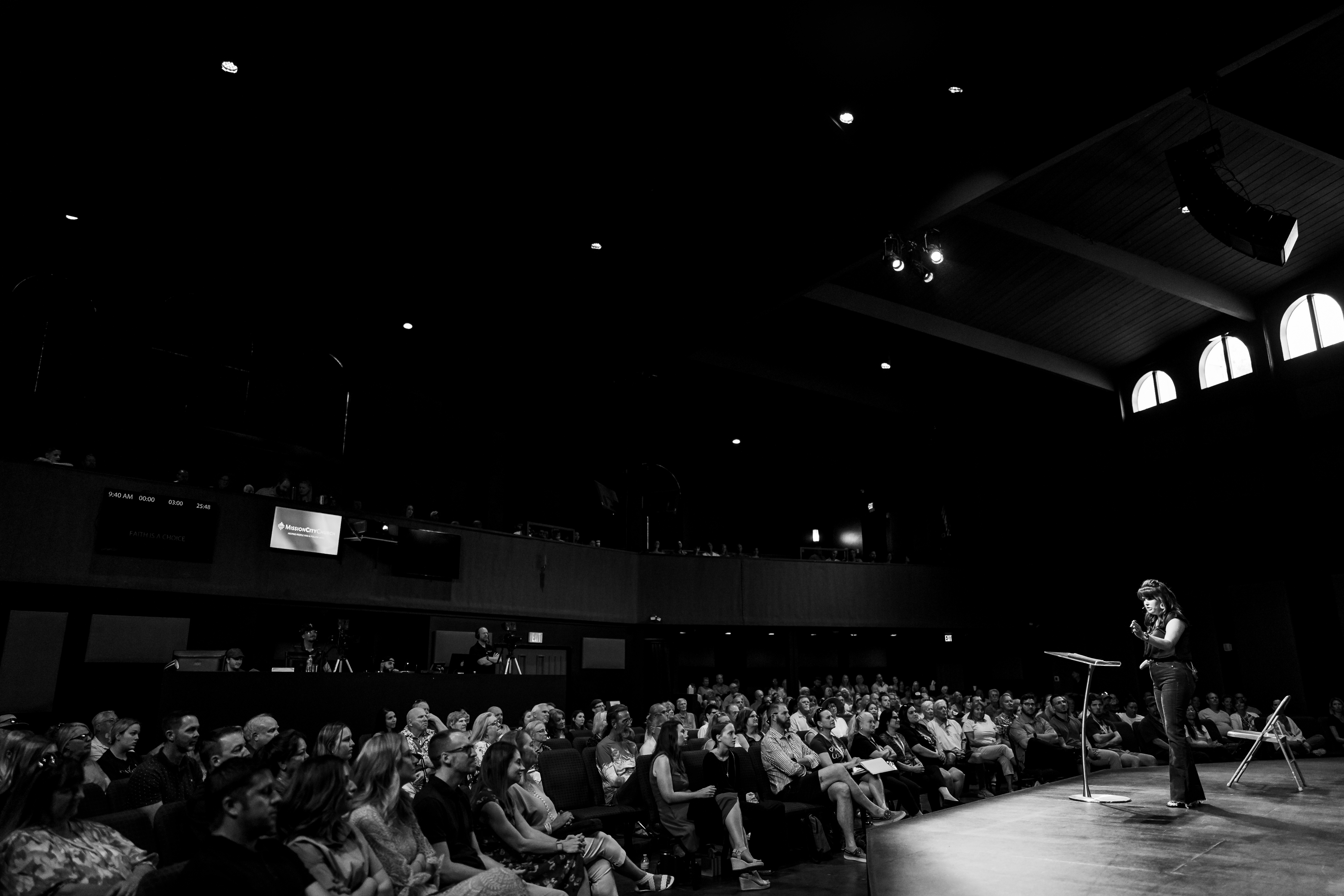Amy Siesel speaking to a full auditorium